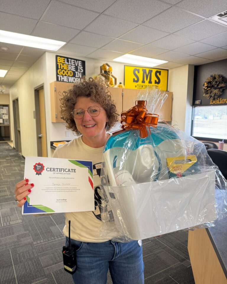 a woman holding a gift box and certificate