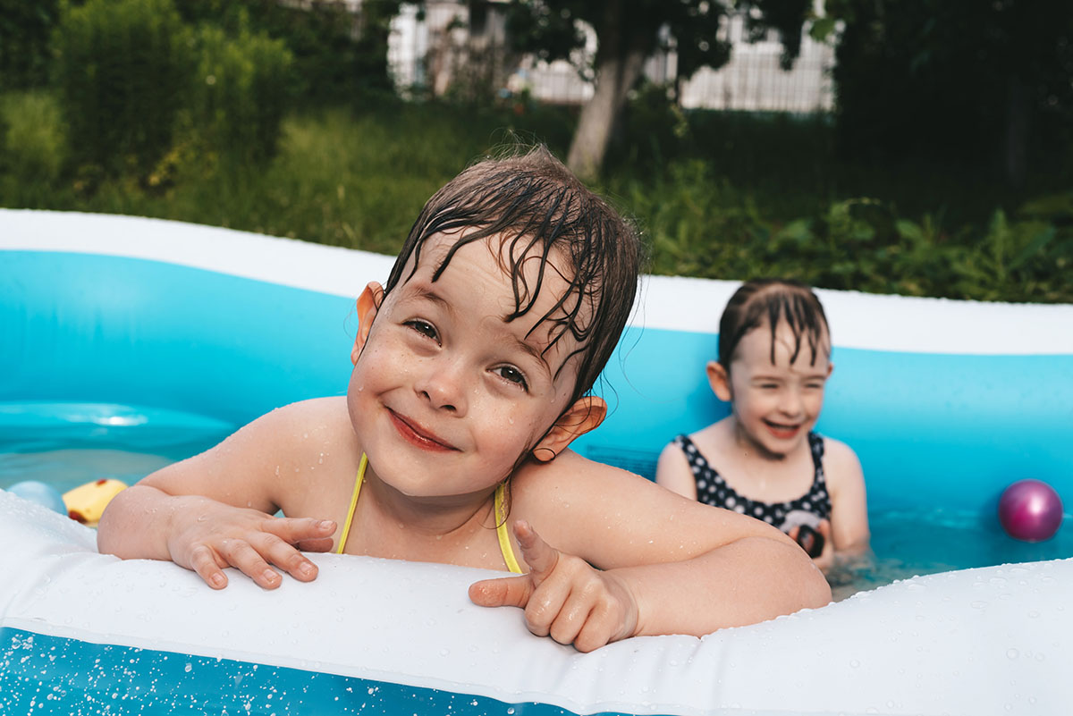 a group of children in a pool