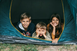 a group of kids in a tent