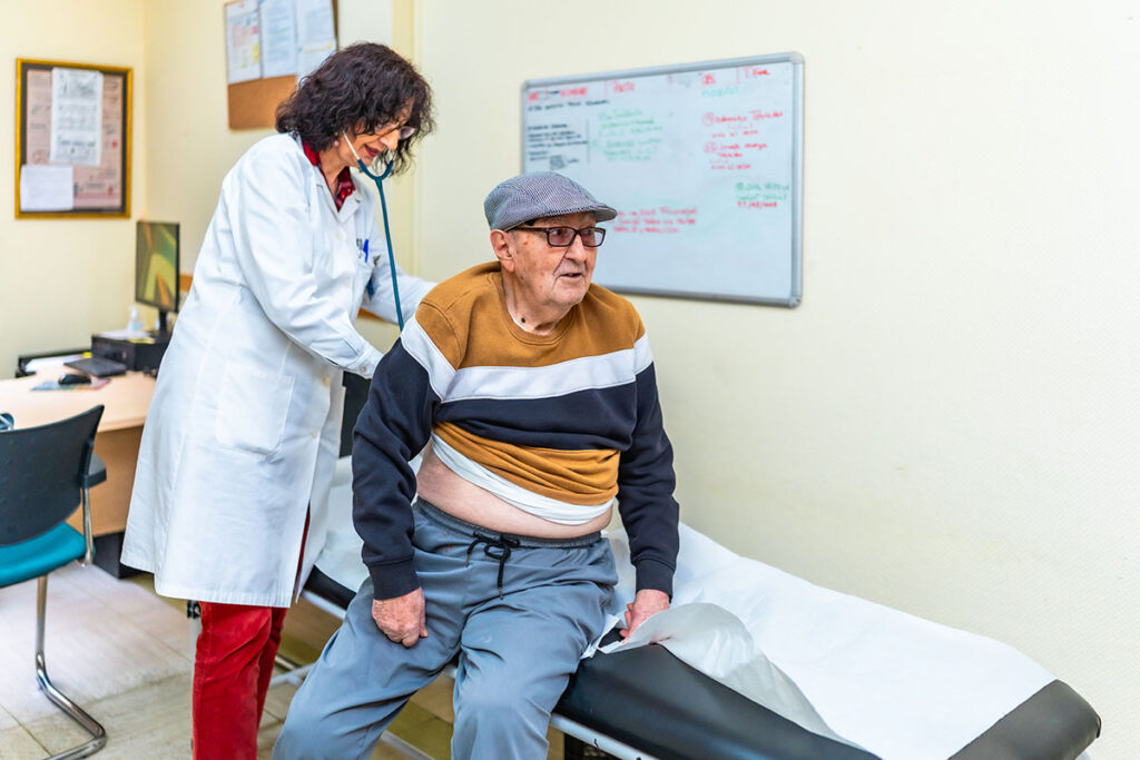 female doctor examining senior male patient in nur 2025 08 26 11 28 48 utc copy