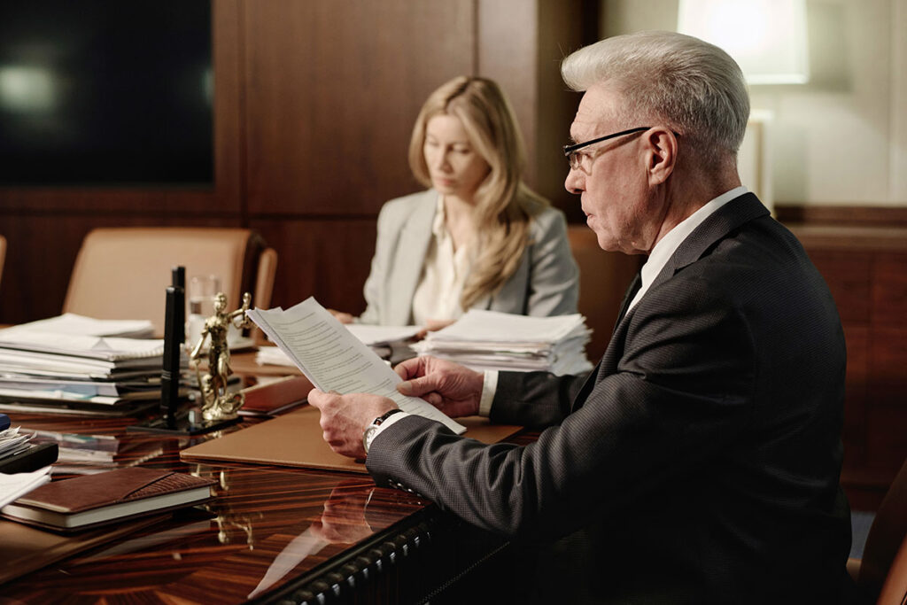 male and female colleagues doing paperwork sitting 2025 02 11 15 41 57 utc copy
