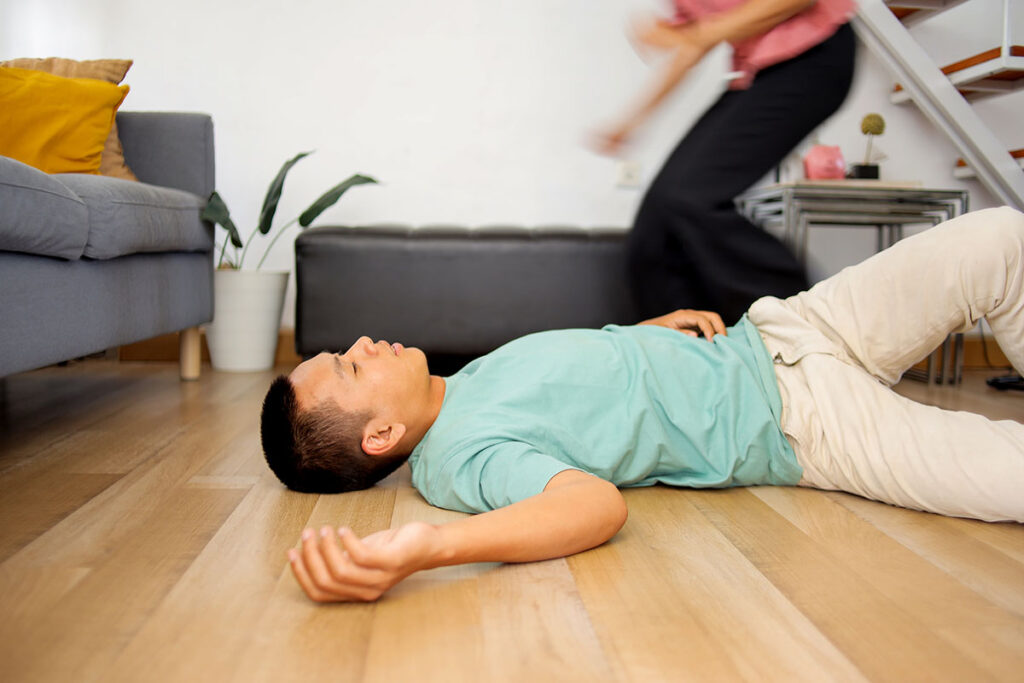 woman wife rushing to help a man husband lying on 2025 03 15 18 38 35 utc copy