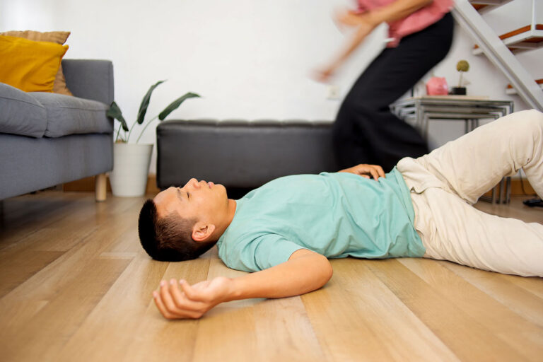 woman wife rushing to help a man husband lying on 2025 03 15 18 38 35 utc copy