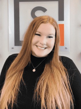 Alyssa smiling in front of the Snellings Law logo