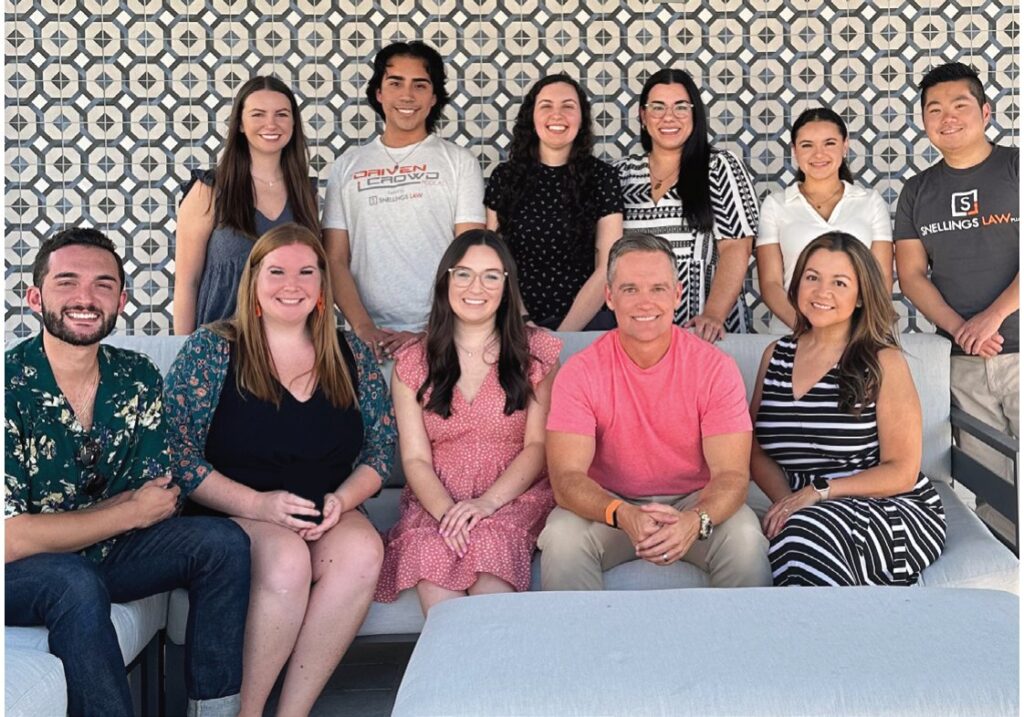 The Snellings Law team seated together for a group photo