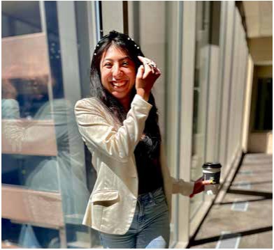 Case manager Belinda smiling beside a sunlit window