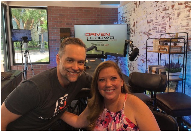 A man and a woman on the set of The Driven Crowd podcast